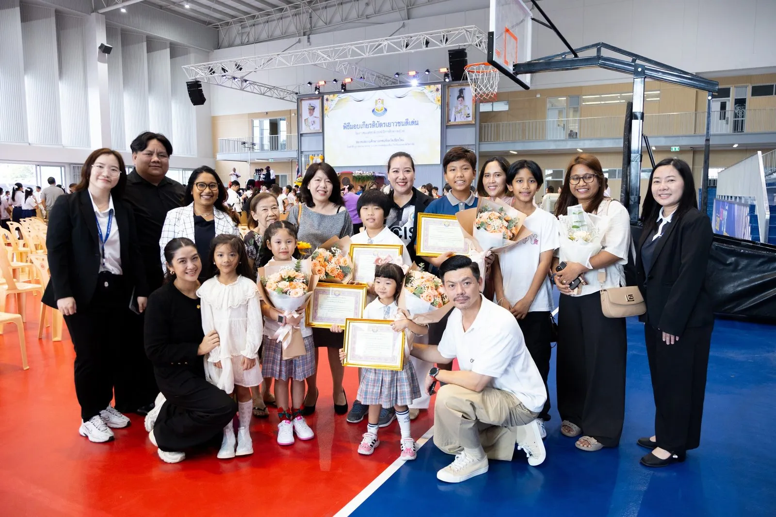 BCIS award recipients, families and staff together in the gymnasium at Montfort College
