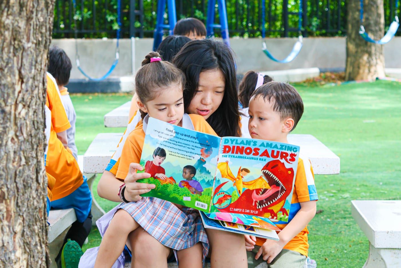Early Years children sharing a story together at BCIS