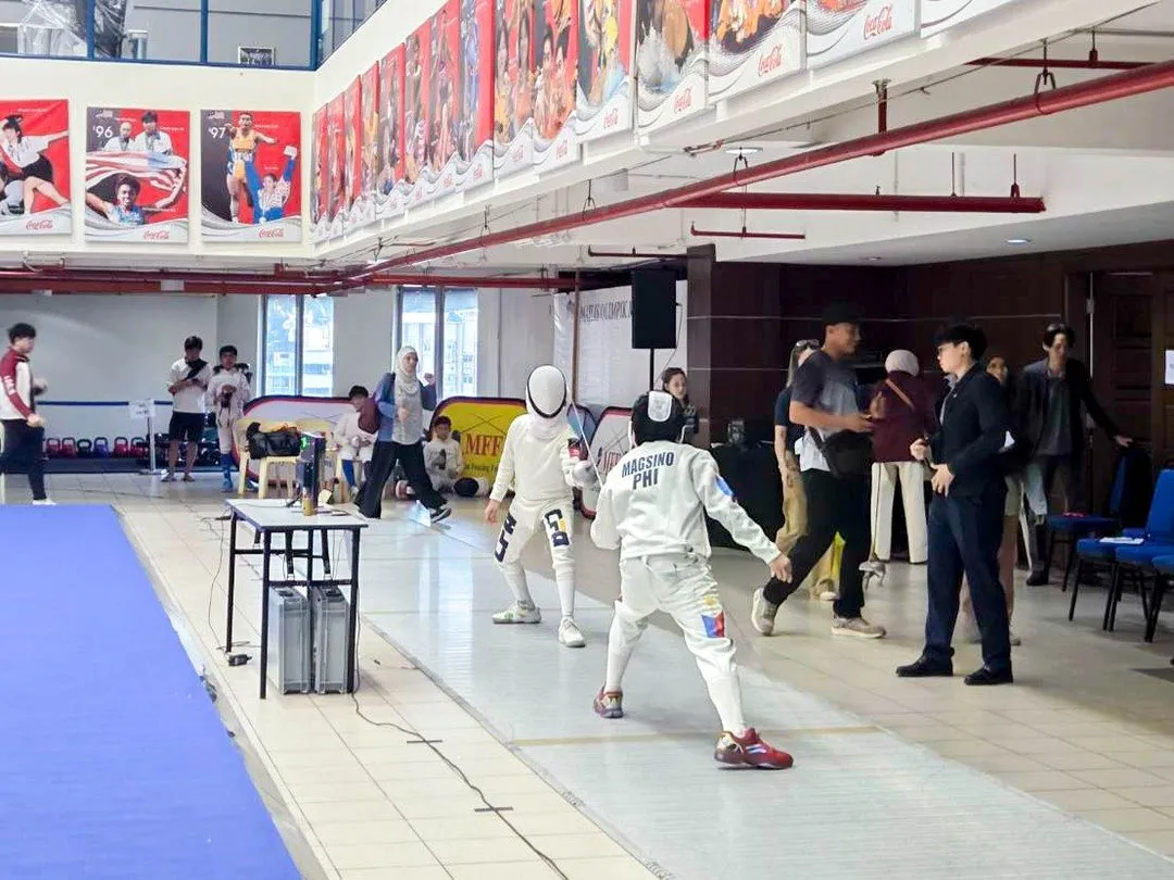 Fencers competing on the piste at the SEAFF Championships