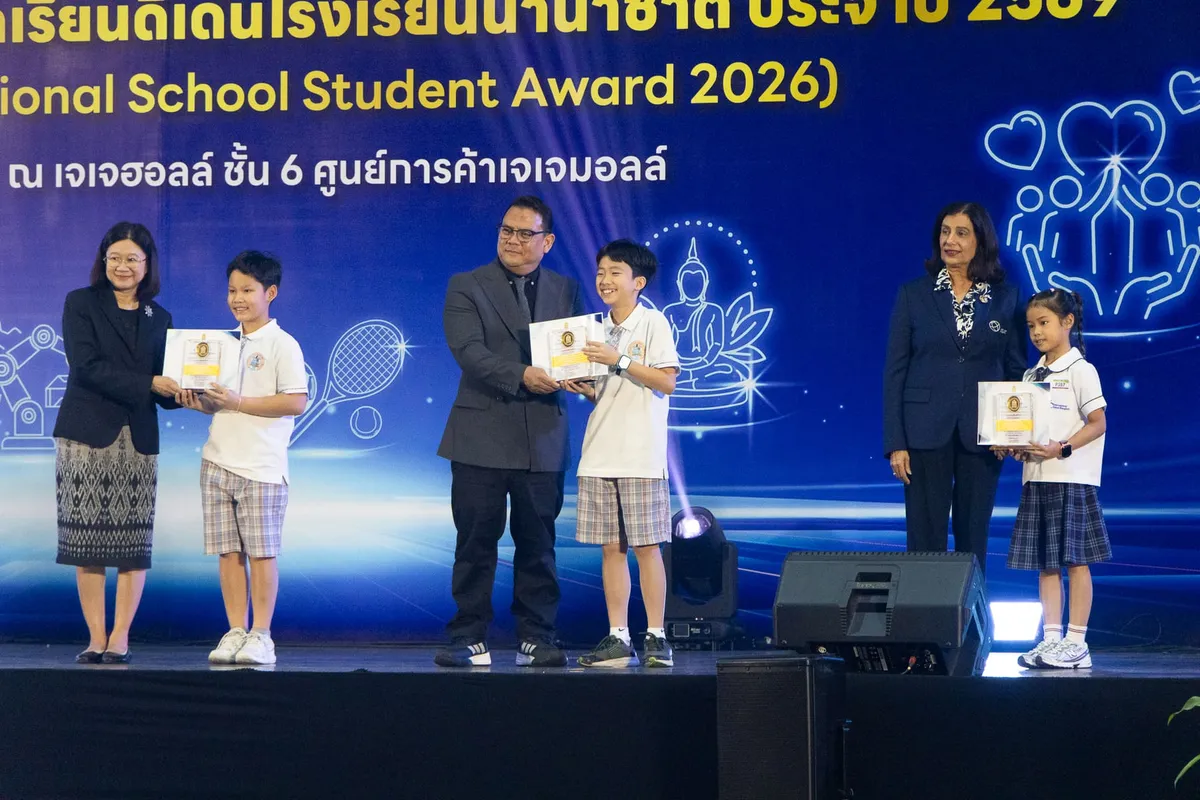 A BCIS student receiving his Sports and Recreation award on stage