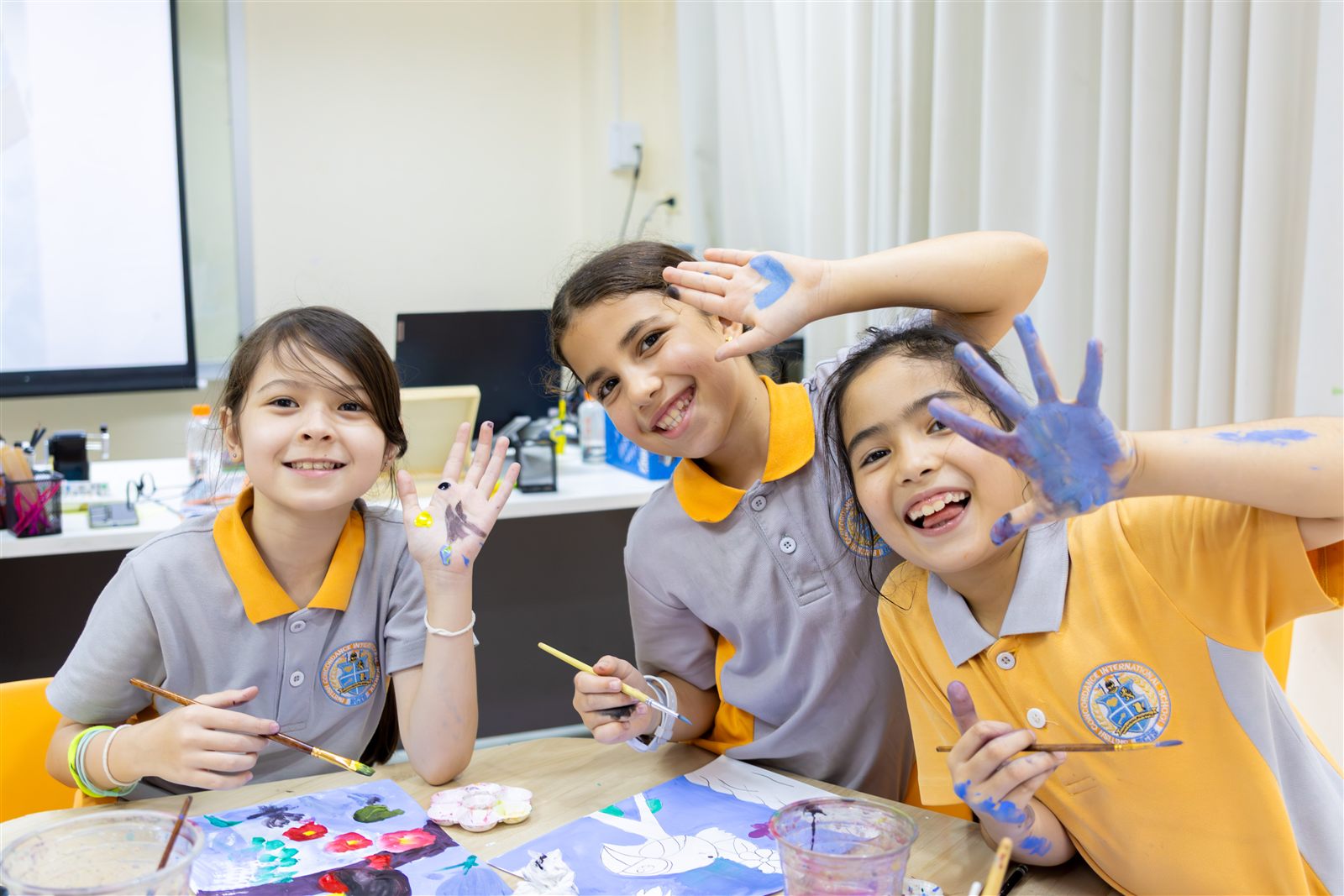 BCIS students enjoying an art lesson