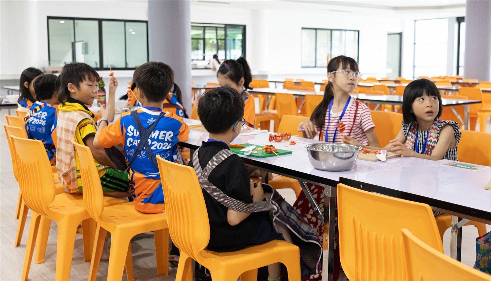 Campers taking part in a World Kitchen cooking activity