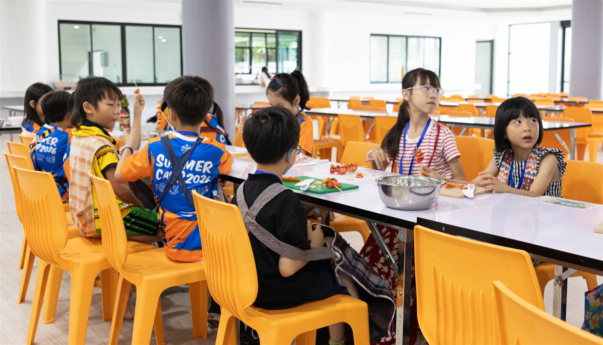 Campers taking part in a World Kitchen cooking activity